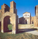 a view of San Pietro basilica in Tuscania with Friar John's arch