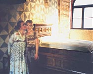 Juliet's House - museum in Verona. Cinzia and Olga among the props from Feffirell's film - the bed of Romeo and Juliet