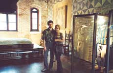 Vladimir and Olga near the bed and costumes from the film of Zeffirelli. Juliet's House museum in Verona
