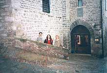 Gubbio. The brick parapet, on which Benvolio was seating with a book