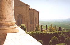 Pienza. The view of the Cathedral apse and Orcia valley from inside Palazzo Piccolomini